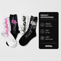 Chaussettes tendance streetwear graffiti pour femmes, mi-mollet, imprimées lettres, style délavé, pour couples, vente en gros