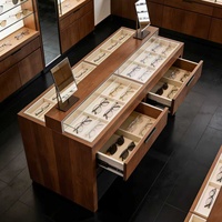 Table de présentation optique moderne de luxe en bois robuste sur mesure avec tiroirs et éclairage LED, design écologique pour magasin de lunettes
