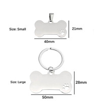 Plaques d'identification pour animaux de compagnie en acier inoxydable en gros, forme de patte creuse, pendentif, logo d'animal de compagnie gravé, étiquette pour animal de compagnie à suspendre transfrontalière, matériau métallique