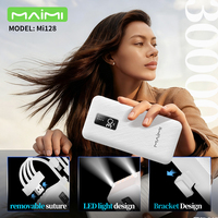 Batterie externe portable Maimi OEM 30000mAh avec câbles intégrés et support de téléphone, chargeur de batterie externe haute capacité pour la vente en gros