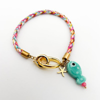 Nouvelle mode, bracelet en acier inoxydable plaqué or 18 carats, corde colorée tressée à la main, petit pendentif en forme d'étoile de poisson, électroplaqué sous vide
