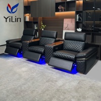 Fauteuil inclinable électrique noir en microfibre pour salon, style moderne, avec fonction massage et extension, idéal pour home cinéma