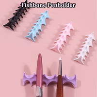 Nouvel outil de manucure 2 en 1 : séparateur d'orteils en silicone en forme d'arête de poisson et support pour stylo à ongles