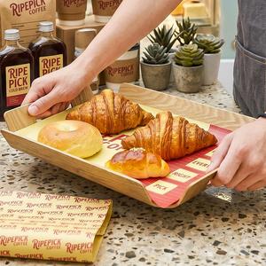 กระดาษห่ออาหารแบบใช้แล้วทิ้งเคลือบ PE กันไขมัน เป็นมิตรกับสิ่งแวดล้อม พิมพ์โลโก้ได้ สำหรับเบเกอรี่ เบอร์เกอร์ แซนวิช เค้ก และขนมปัง - Product Image 4