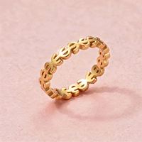 Bague de couple en acier titane doré, motif dollar creux, style euro-américain populaire, pour une touche de personnalité