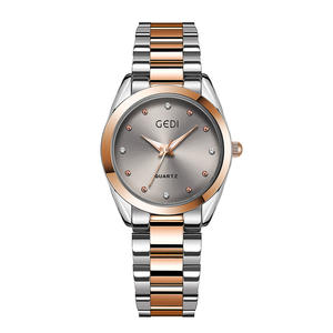 Elegante reloj de pulsera para mujer con esfera redonda con incrustaciones de diamantes, reloj de cuarzo con correa de acero. - Product Image 1