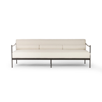 Canapé d'extérieur vintage en chanvre naturel à profil bas avec cadre métallique épuré et coussins de soutien, résistant aux intempéries, style Granger Muebles De Jardin