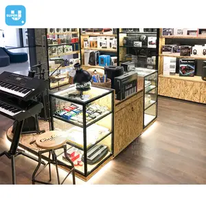 Tienda de instrumentos musicales personalizada, diseño de interiores, iluminación con cerradura, escaparate de exhibición de guitarra de vidrio de madera para Kit de batería