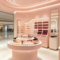 Écrins de présentation cosmétiques roses personnalisés et vitrines murales rétroéclairées par LED, idéales pour les boutiques de maquillage et de rouges à lèvres