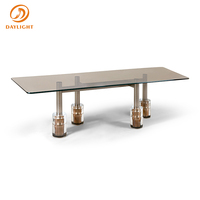 Table à manger longue en marbre vert avec pieds en acier inoxydable de luxe moderne