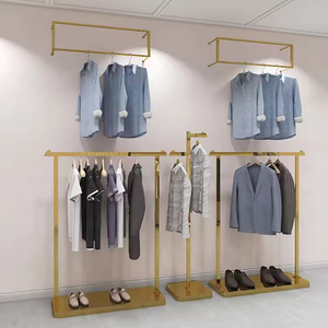 Muebles de vidrio de Metal personalizados de oro Boutique para tienda de <span class=keywords><strong>ropa</strong></span> de <span class=keywords><strong>mujer</strong></span> estante de exhibición de <span class=keywords><strong>ropa</strong></span> de <span class=keywords><strong>mujer</strong></span> soporte para uso de boda al por menor - Product Image 1