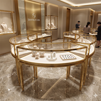 Comptoir de présentation de bijoux de luxe en acier inoxydable miroir, avec arc doré incurvé, pour exposition de diamants fins, éclairage LED, écologique