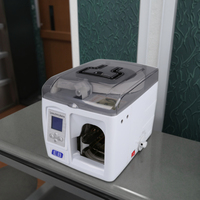 Machine d'emballage de billets de banque en plastique EB JB-211 avec vitesse de bandeage de 2 secondes pour les liasses de devises et le cerclage de l'argent