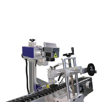 Machine de marquage laser UV à positionnement automatique sur convoyeur à rouleaux pour tubes cosmétiques ronds, avec marquage de la date de production et impression de logo laser