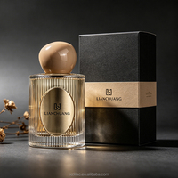 Flacon de parfum en verre transparent de luxe de haute qualité de 50 ml avec étiquette métallique de couleur personnalisée et boîtes cadeaux de luxe pour la vente en gros