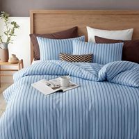 Nouvelle housse de couette rayée bleue, douce et respirante, taie d'oreiller soyeuse et lisse, ensemble de housse de couette de luxe discret pour hôtel