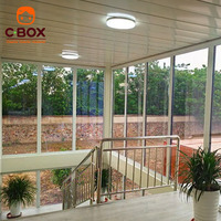 Cbox Maison conteneur modulaire préfabriquée à deux étages avec mur-rideau en verre, bureau, balcon et escalier