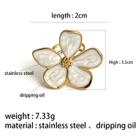 Bagues ouvertes en acier inoxydable étanche, deux styles, motif floral creux en zircon et fleur en émail blanc, pour femmes, vente en gros