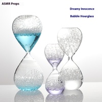 Vente en gros de sablier à eau liquide en verre à haute teneur en borosilicate personnalisé sablier coloré décoration moderne pour anniversaire personnalisé