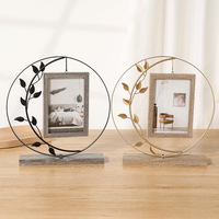 Cadre photo en cercle de fer en gros, base en bois avec feuilles noires, décoration bohème pour la maison, MOQ flexible, directement de l'usine