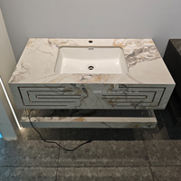 Meuble-lavabo flottant personnalisé en pierre frittée avec comptoir en surface solide, vasque en marbre et miroir LED pour salle de bain