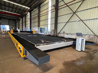 Máquina de corte por láser de fibra de alta potencia para riel de tierra de pórtico de 30000W con cabezal oscilante para industrias de fabricación de estructuras de acero