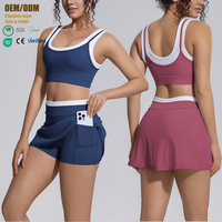Ensemble de yoga pour femme effet seconde peau, color block, soutien-gorge dos croisé, jupe-short de tennis taille haute avec poches, respirant, pour la gym