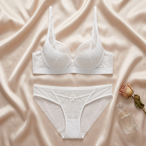 Conjunto de lencería sexy de encaje floral blanco al por mayor, sujetador con aros y bragas de malla transparente, lencería íntima elegante y cómoda para mujer - Product Image 1