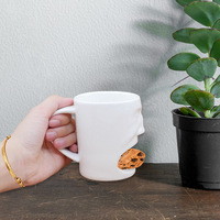 OEM ODM Nouvelle tasse à biscuits en céramique à visage 3D créative Tasse à café et thé à biscuits en porcelaine nordique personnalisée pour cadeau