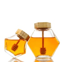 Pot de stockage d'abeilles en verre hexagonal en gros d'usine 180ml 220ml 380ml avec couvercle en bambou de louche en bois pour la nourriture pour l'usage de cuisine