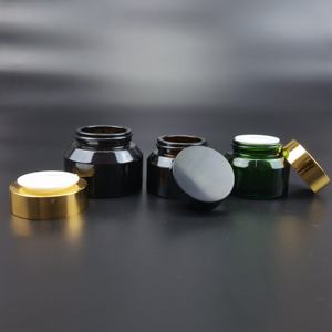Tarro de vidrio redondo de 50g/100g transparente/negro/verde/azul con hombro inclinado y tapa de plástico dorada/negra - Product Image 2