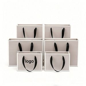 High Strength Custom Logo Printed Luxury Fashion Retail Gift Packaging Eco Reusable Rope Handle <b>Paper</b> Bag - Product Image 1