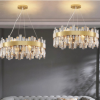 Lustre JYLIGHTING élégant ovale elliptique en cristal, colonne dorée mate brossée, suspension verticale scintillante à bords irréguliers pour plafond