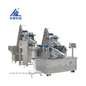 Machine d'assemblage <span class=keywords><strong>de</strong></span> seringues Zhejiang Huanchou 2024-6 avec moteur, boîte <span class=keywords><strong>de</strong></span> vitesses et composants PLC en acier inoxydable, garantie 1 an - Product Image 1