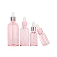 Bouteille d'huile essentielle en verre rose de fantaisie de 20ml en forme de cylindre avec compte-gouttes pour la beauté soins de la peau sérum et crème Commande minimum 500 pièces