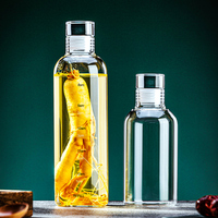 Bouteille d'eau en verre borosilicaté transparent à couvercle en verre de grande capacité portable en gros