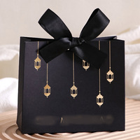Boîte-cadeau transfrontalière pour le festival Rama du Moyen-Orient, design étoile et lune orné d'or, emballage de bonbons de fête noir et blanc en papier