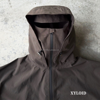 Veste coupe-vent en nylon imperméable personnalisée avec capuche, fermeture éclair de haute qualité, design tendance