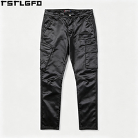 Pantalon cargo skinny personnalisé en denim ciré, aspect cuir, coupe ajustée, avec empiècements, style techwear, vente en gros