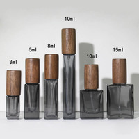 Flacon en verre de parfum noir translucide à logo personnalisé 3ml 10ml 15ml recharge de parfum Rollerball flacon vaporisateur de parfum haut de gamme