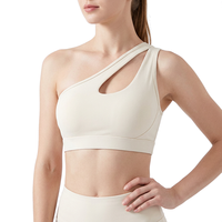 Soutien-gorge de sport asymétrique à découpes, avec bretelles et coussinets amovibles, pour femme, idéal yoga, gym, course à pied, en nylon et élasthanne, commande en gros