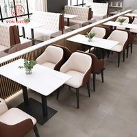 Meubles de salle à manger de café de luxe canapé demi-rond en cuir avec design matelassé ensemble de table et de chaises rondes en marbre commercial