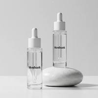 Flacon de sérum en verre cylindrique de haute qualité, personnalisable, finition mate, rechargeable, avec bouton poussoir métallique, emballage cosmétique