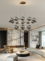 Lustre rond moderne en or multi-couches avec abat-jour en verre ambré et éclairage LED pour salon de villa, entrée et grenier