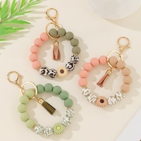 Bracelet en silicone fait main marguerite, pendentif porte-monnaie, breloque porte-clés anti-perte, style américain, le plus vendu
