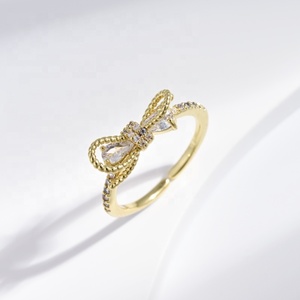 Anillo de compromiso de plata de ley 925 con nudo, chapado en oro de 18k, con circonita, diseño de lazo, elegante y económico, para chicas. - Product Image 1