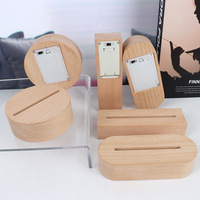 Support d'affichage lumineux minimaliste en bois avec base LED, alimenté par batterie, pour panneaux circulaires en acrylique