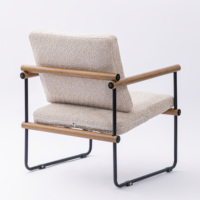 Fauteuil individuel moderne capitonné avec dossier ailé et repose-pieds, structure métallique, idéal pour salle à manger, bureau et salon - Vente en gros usine