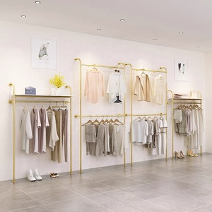 Listo para enviar, estante de ropa de Metal bonito a la moda, estante de ropa montado en la pared dorado de acero inoxidable para exhibición de <span class=keywords><strong>tienda</strong></span> de mujeres Boutique - Product Image 5
