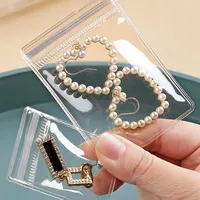 Sachet Doypack PVC Transparent avec Fermeture Éclair en Gros, Impression Héliogravure, Mini Emballage Jetable pour Bijoux (Bracelets, Bagues, Boucles d'Oreilles)